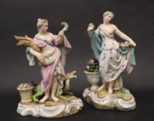 A pair of continental porcelain figures depicting summer holding a basket of flowers with an urn of