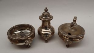 A George VI silver three piece cruet set of cauldron shape comprising a pepperette,