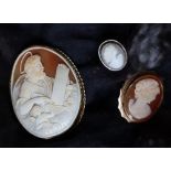 A 9ct gold mounted shell cameo brooch depicting Moses holding a tablet with a winged cherub beneath,
