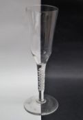 A 19th century wine glass with a tall tapering bowl and double helix cotton twist stem on a