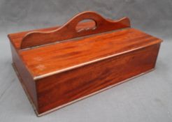 A 19th century mahogany butlers cutlery tray of rectangular form with a raised cut out handle and