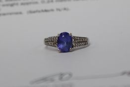 A AAA Tanzanite and Diamond ring, set with an oval tanzanite approximately 1.