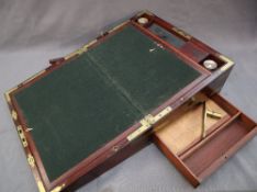 A 19th century mahogany copying machine writing desk, with brass corners and central cartouche,