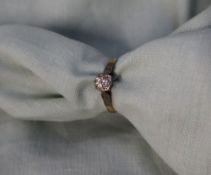 A solitaire diamond ring,