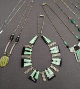 An Art Deco style green and black bakelite necklace together with other necklaces