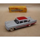 A Dinky Toys 192 De Soto Fireflite Sedan in grey with red roof and flash,