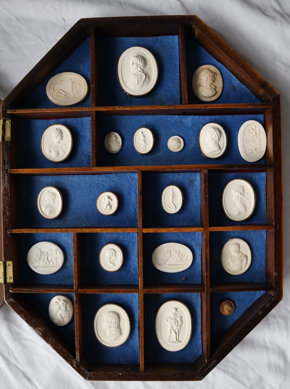 A collection of Grand Tour plaster portraits of varying sizes,