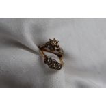 A diamond cluster ring set with old cut diamonds to a white metal setting and 18ct yellow gold