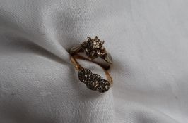 A diamond cluster ring set with old cut diamonds to a white metal setting and 18ct yellow gold