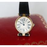 A lady's Must de Cartier silver gilt wristwatch,
