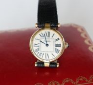 A lady's Must de Cartier silver gilt wristwatch,