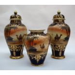 A garniture of three Noritake vases, including two lidded vases 27cm high and a twin handled vase,