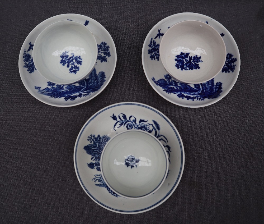 A pair of 18th century Worcester porcelain tea bowls and saucers decorated in the birds in branches - Image 2 of 3