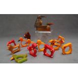 A set of five bakelite novelty napkin rings in the form chicks together with a set of four rabbit