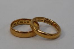 Two 22ct yellow gold wedding bands,