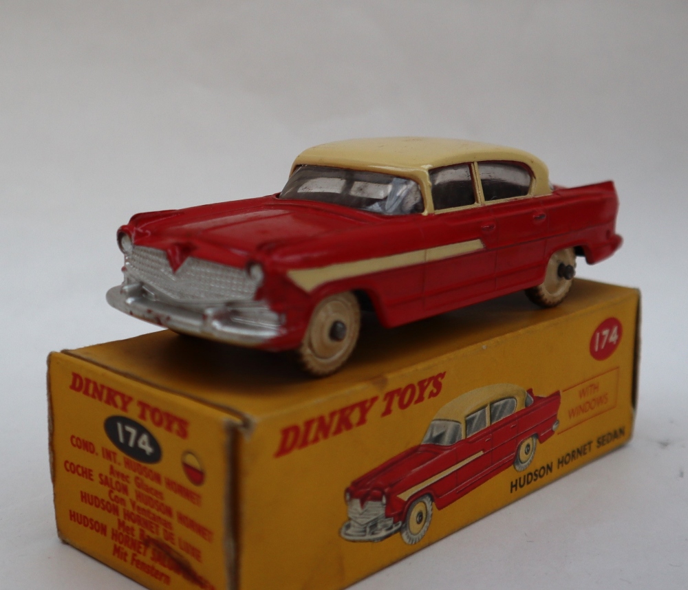 A Dinky Toys 174 Hudson Hornet Sedan with red lower body, cream roof, flash and hubs, - Image 2 of 4