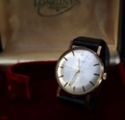 A gentleman's 9ct gold Longines wristwatch, with a silvered dial and batons,