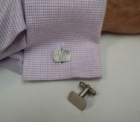 A pair of Silver cufflinks of rectangular form with rounded corners and line decoration,