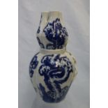 A Chinese porcelain blue and white trefoil vase with prunus blossom decoration, 21.