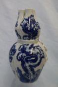 A Chinese porcelain blue and white trefoil vase with prunus blossom decoration, 21.