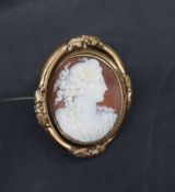 A shell cameo portrait brooch of a maiden in profile in a rotating pinchbeck mount