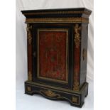 A 19th century French Boulle work side cabinet with a rectangular top above a gilt metal egg and