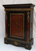 A 19th century French Boulle work side cabinet with a rectangular top above a gilt metal egg and