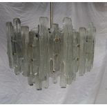 A mid 20th century moulded glass chandelier / ceiling light with three tiers of glass panels