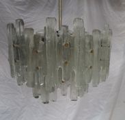 A mid 20th century moulded glass chandelier / ceiling light with three tiers of glass panels