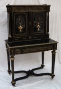 A 19th century French cabinet on stand, the shaped top with a three quarter gallery,