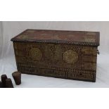A 19th century hardwood coffer with brass studded decoration with carrying handles,
