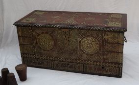 A 19th century hardwood coffer with brass studded decoration with carrying handles,