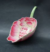 A Chinese porcelain pink leaf shaped dish, the hollow leaf handle with characters on the reverse,