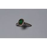 An emerald and diamond ring,