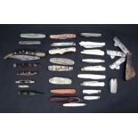 An Indian folding pen knife together with a collection of pen knives,