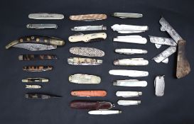 An Indian folding pen knife together with a collection of pen knives,