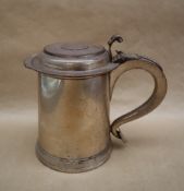 A 19th century silver on copper lidded tankard the hinged lid inset with a Charles II coin dated