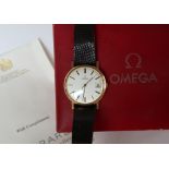A gentleman's 9ct gold Omega wristwatch, the circular silvered dial with batons and a date at 3,
