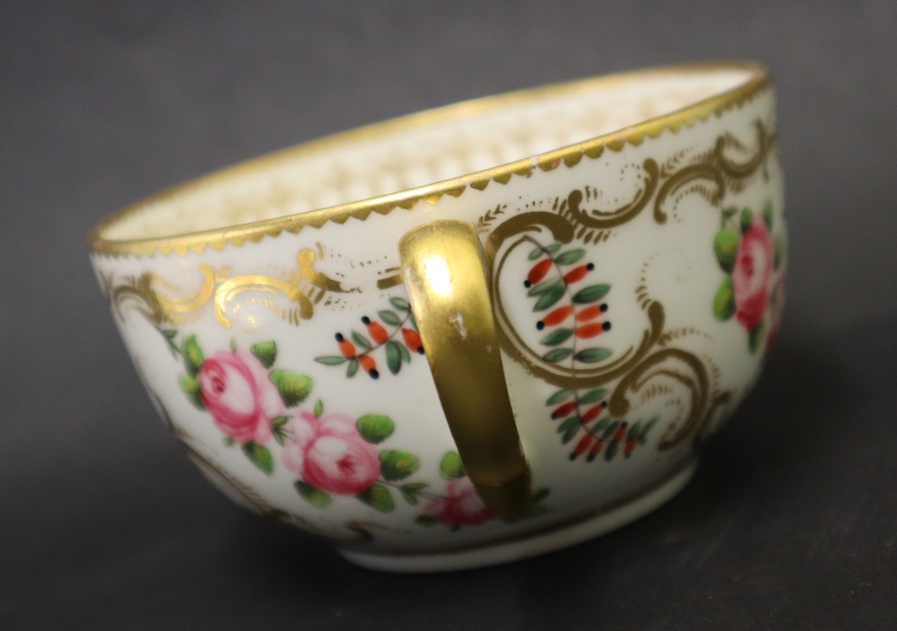 A Swansea porcelain tea cup and saucer painted with roses in a gilt garland border, 9. - Image 5 of 6