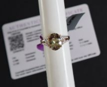 Gemporia - an 18ct gold Csarite and diamond ring, set with a 3.