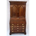 An 18th century oak bureau bookcase,