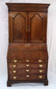 An 18th century oak bureau bookcase,