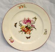 A Berlin porcelain plate with a cerise line rim decorated to the centre with a bouquet of flowers