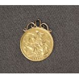 A Victorian gold sovereign dated 1887 with a scrolling mount, approximately 8.