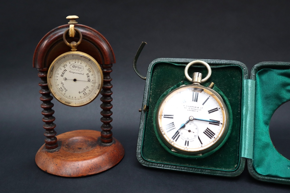 A gilt metal compensated pocket barometer, with a silvered dial,