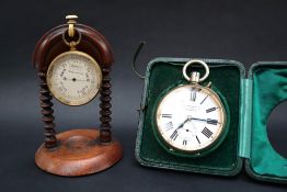 A gilt metal compensated pocket barometer, with a silvered dial,