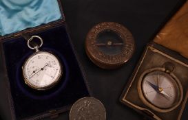 A white metal stop watch, with a white enamel dial and two subsidiary dials,