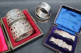 A pair of Edward VII silver napkin rings with pierced shamrock decoration,