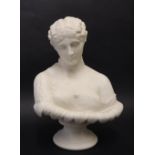 A parian porcelain bust of a maiden with an off the shoulder garment and leaf rim on a socle base,