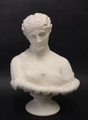 A parian porcelain bust of a maiden with an off the shoulder garment and leaf rim on a socle base,